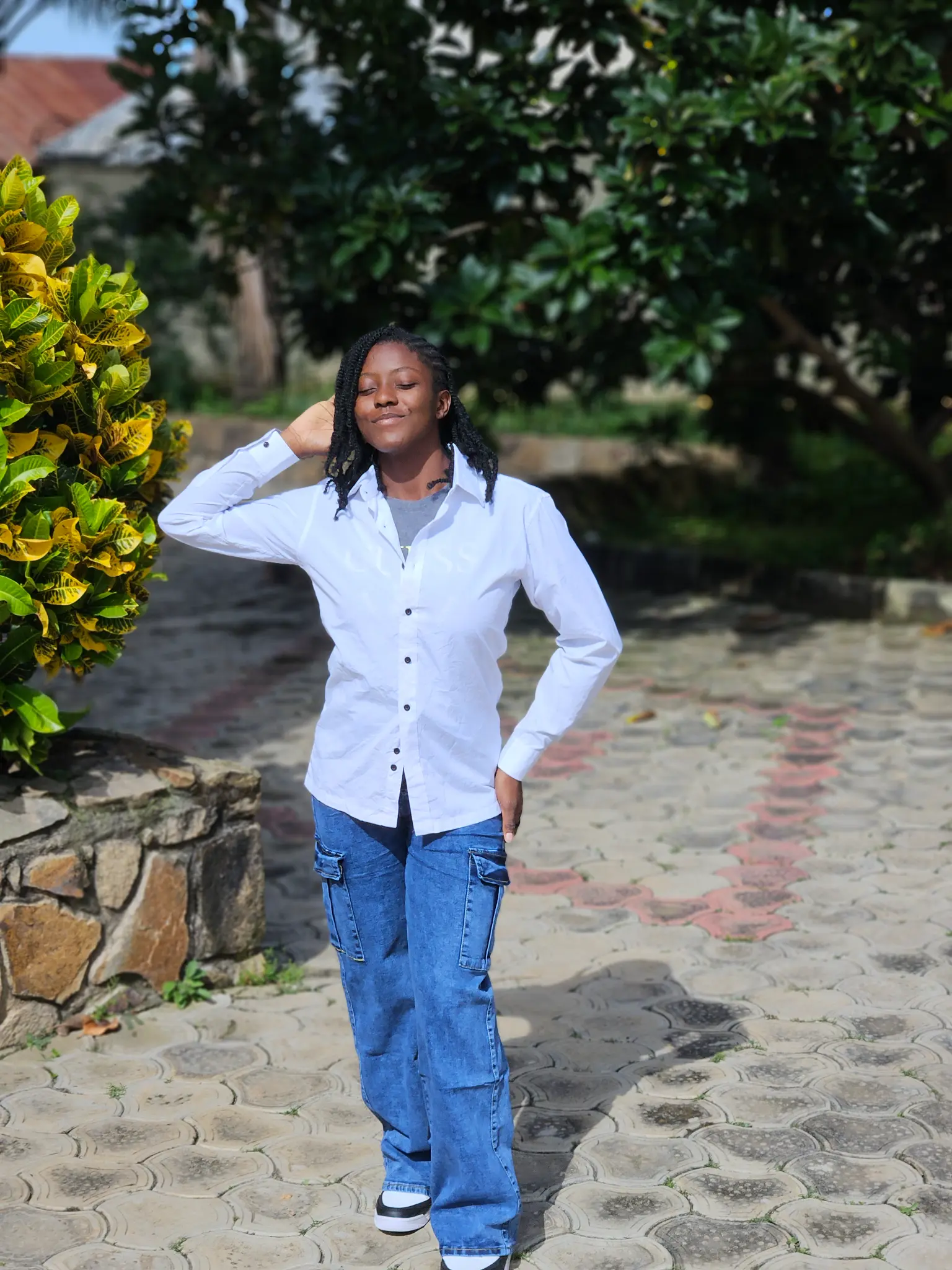 Portrait of my sister outdoors in a white shirt